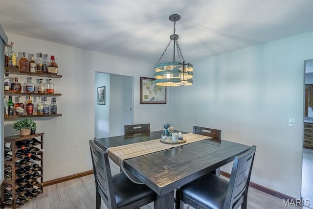 616 E Brentmoor Dr, Troy, IL 62294 - dining space with a chandelier and light wood-style floors