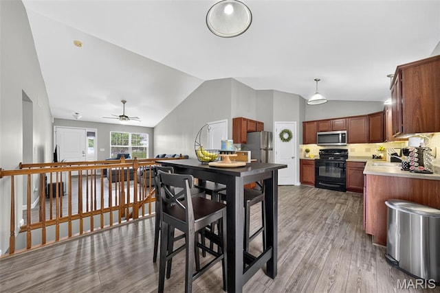 40 Valley Farms Dr, Winfield, MO 63389 - dining space featuring vaulted ceiling, light wood-style flooring, and ceiling fan
