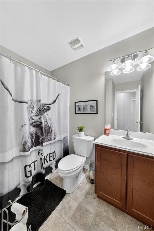 40 Valley Farms Dr, Winfield, MO 63389 - bathroom featuring toilet and vanity