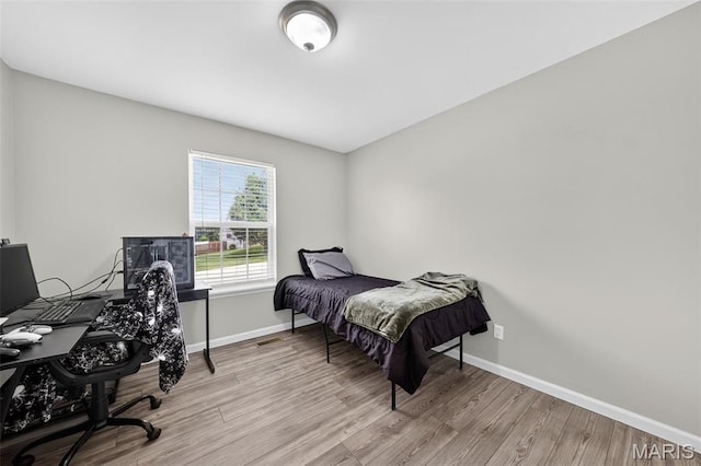 40 Valley Farms Dr, Winfield, MO 63389 - bedroom featuring wood finished floors and a desk