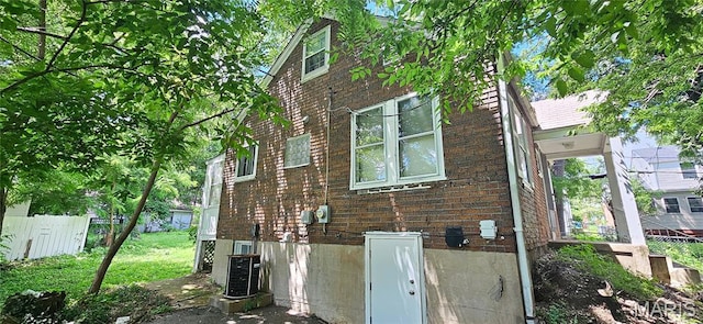 601 Chanslor, Ferguson, MO 63135 - view of side of home with brick siding and a central AC unit