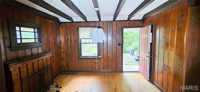 601 Chanslor, Ferguson, MO 63135 - foyer entrance with light wood finished floors, beamed ceiling, wooden walls, and healthy amount of natural light