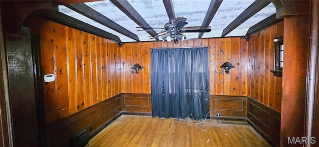 601 Chanslor, Ferguson, MO 63135 - detailed view of ceiling fan, wood finished floors, arched walkways, wooden walls, and beamed ceiling