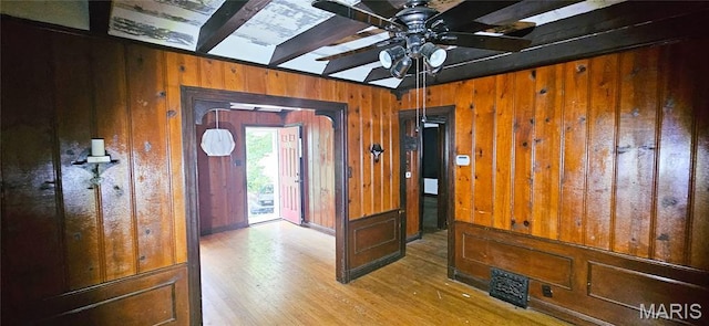 601 Chanslor, Ferguson, MO 63135 - entryway with beamed ceiling, wooden walls, ceiling fan, and wood finished floors