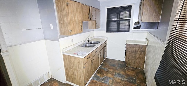 601 Chanslor, Ferguson, MO 63135 - kitchen featuring light countertops and dark stone finish floors