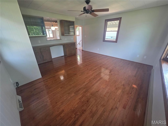 132 Linn Dr, Saint Genevieve, MO 63670 - unfurnished living room with dark wood-style flooring and a ceiling fan