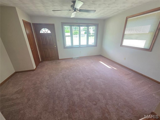 132 Linn Dr, Saint Genevieve, MO 63670 - entryway with ceiling fan, light colored carpet, and a textured ceiling
