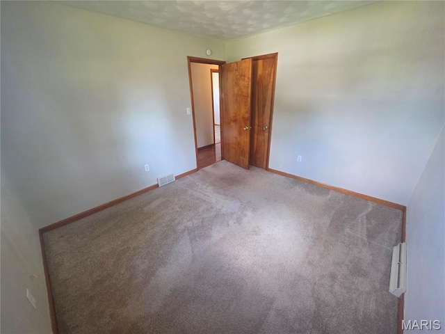 132 Linn Dr, Saint Genevieve, MO 63670 - spare room featuring carpet and a textured ceiling