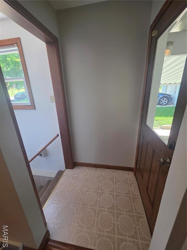 132 Linn Dr, Saint Genevieve, MO 63670 - doorway to outside featuring light floors and baseboards