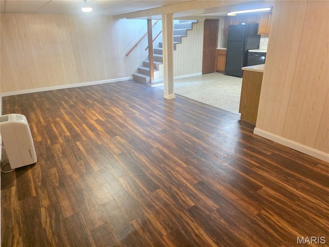 132 Linn Dr, Saint Genevieve, MO 63670 - finished below grade area featuring freestanding refrigerator, dark wood finished floors, and wood walls