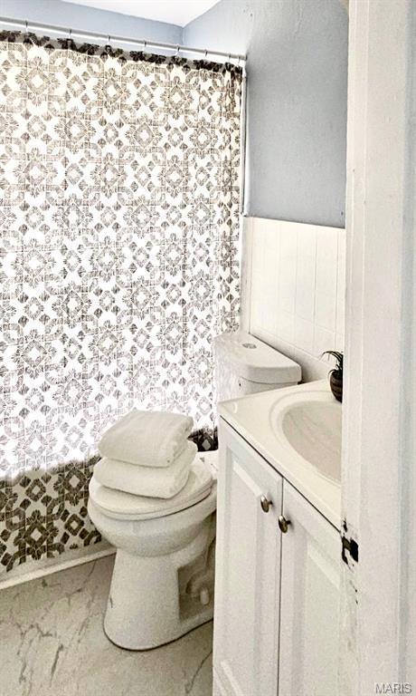 6110 Wyma Ave, Pine Lawn, MO 63120 - bathroom with vanity and a shower with shower curtain