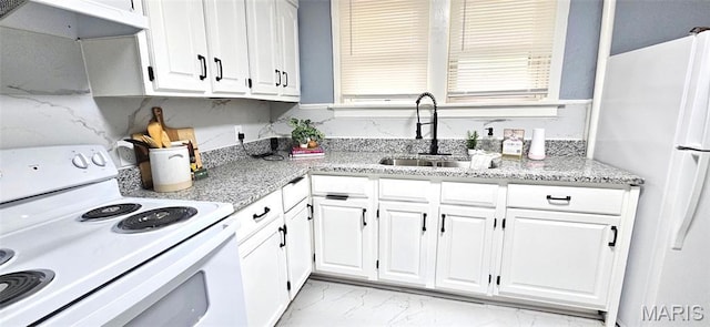 6110 Wyma Ave, Pine Lawn, MO 63120 - kitchen featuring white appliances, light marble finish floors, white cabinetry, and light stone countertops