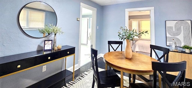 6110 Wyma Ave, Pine Lawn, MO 63120 - dining space with baseboards and wood finished floors