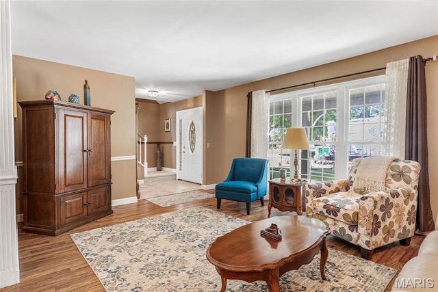 5028 Baldcypress Ct, Saint Louis, MO 63128 - living area featuring light wood-style floors and stairway