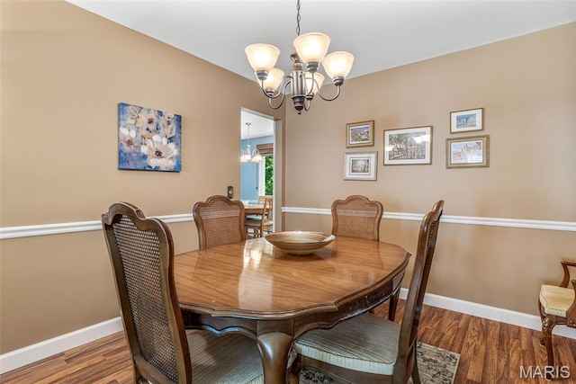 5028 Baldcypress Ct, Saint Louis, MO 63128 - dining space featuring a chandelier and wood finished floors