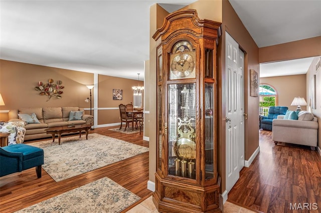 5028 Baldcypress Ct, Saint Louis, MO 63128 - entrance foyer featuring wood finished floors and a chandelier