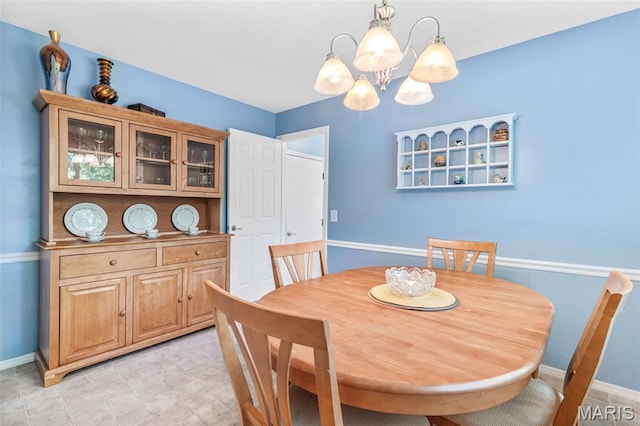 5028 Baldcypress Ct, Saint Louis, MO 63128 - dining space with a chandelier and baseboards