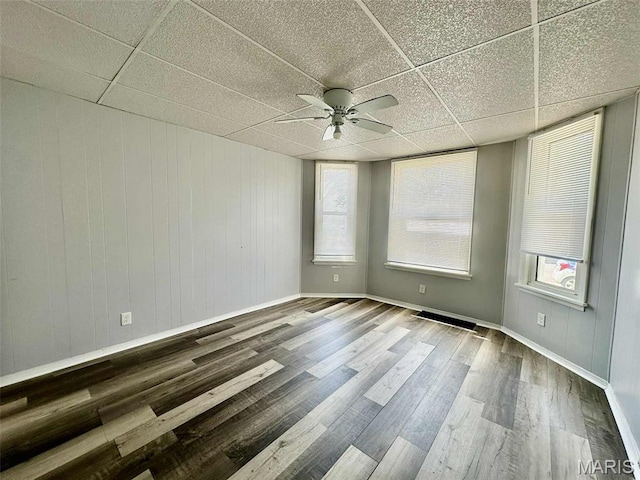 316 Church St, East Alton, IL 62024 - unfurnished room featuring wood finished floors, ceiling fan, and a paneled ceiling