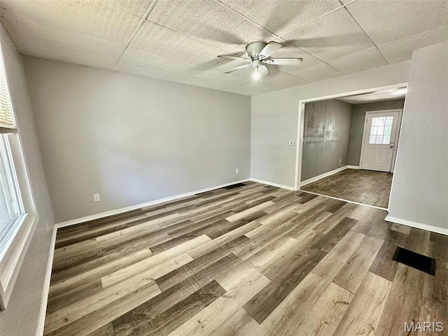 316 Church St, East Alton, IL 62024 - spare room featuring ceiling fan, wood finished floors, and a drop ceiling