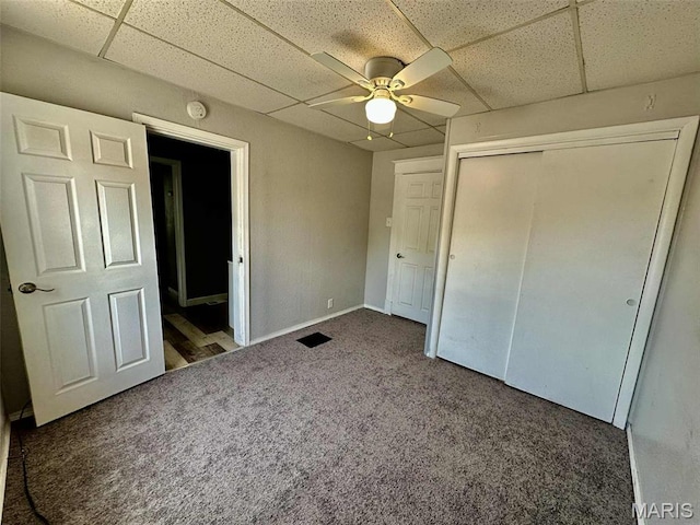 316 Church St, East Alton, IL 62024 - unfurnished bedroom featuring a paneled ceiling, carpet flooring, a closet, and ceiling fan
