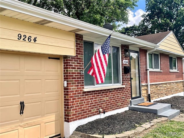 9264 Bellefontaine Rd, Bellefontaine Nghbrs, MO 63137 - property entrance with brick siding