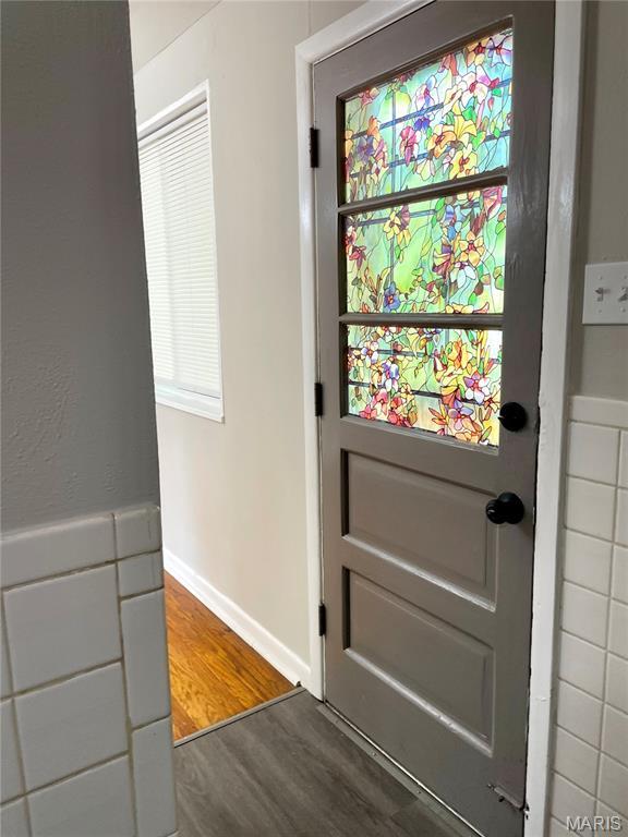 9264 Bellefontaine Rd, Bellefontaine Nghbrs, MO 63137 - doorway to outside with wood finished floors