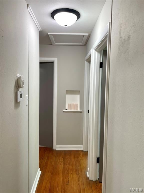 9264 Bellefontaine Rd, Bellefontaine Nghbrs, MO 63137 - hall with attic access and wood finished floors