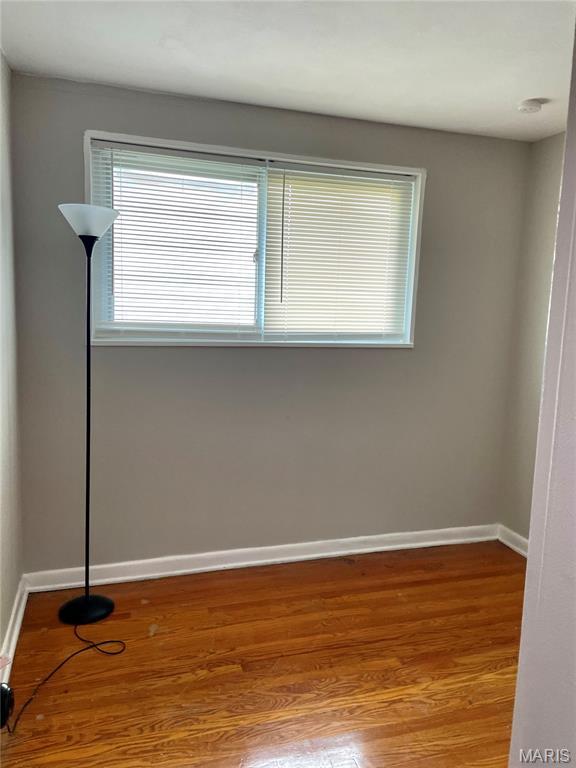 9264 Bellefontaine Rd, Bellefontaine Nghbrs, MO 63137 - empty room with baseboards and wood finished floors