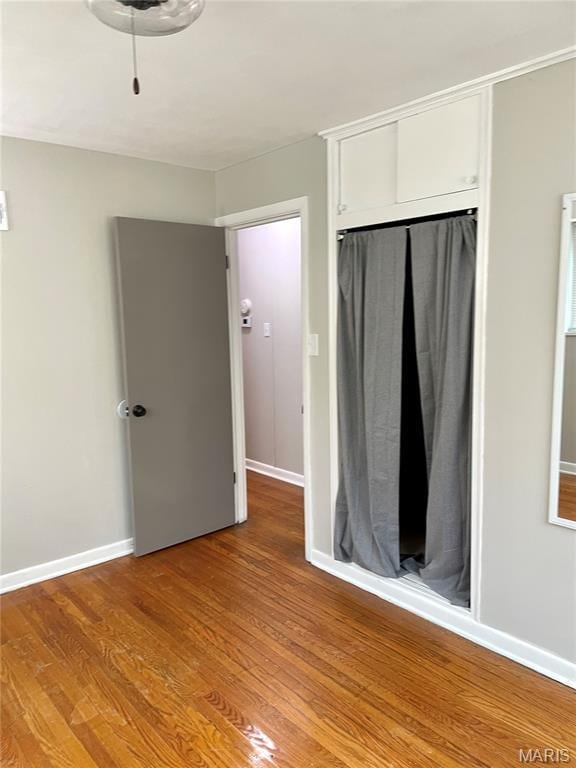 9264 Bellefontaine Rd, Bellefontaine Nghbrs, MO 63137 - unfurnished bedroom featuring light wood finished floors and a closet