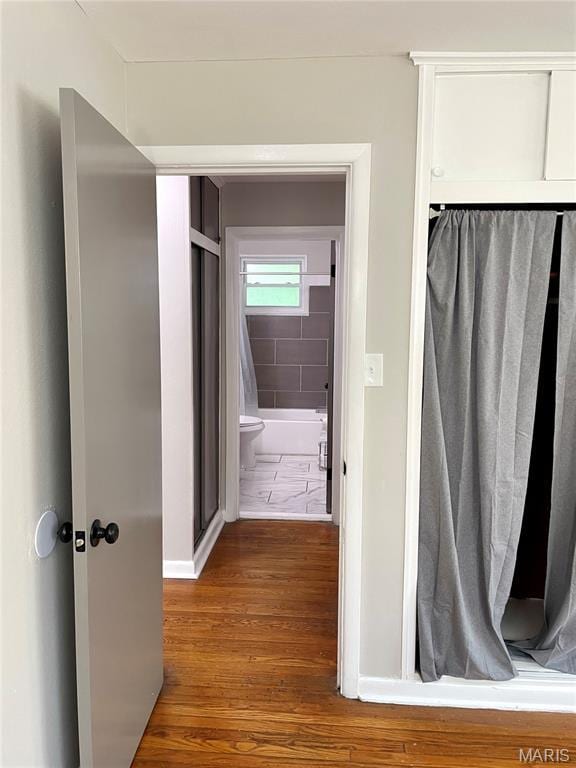 9264 Bellefontaine Rd, Bellefontaine Nghbrs, MO 63137 - hallway with wood finished floors and baseboards
