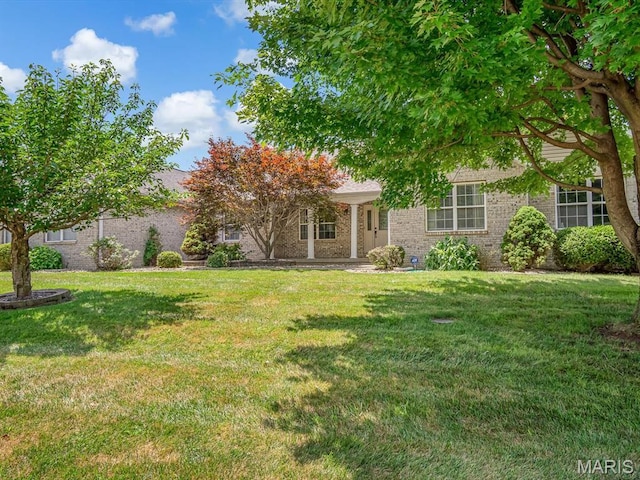 22 Foxmoor Dr, Maryville, IL 62062 - obstructed view of property featuring a front yard and brick siding