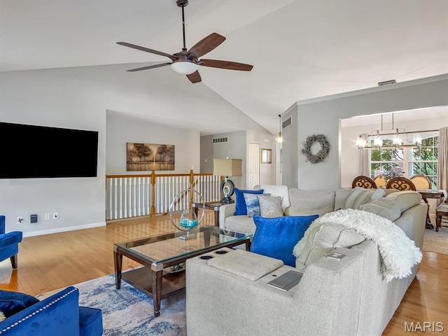 22 Foxmoor Dr, Maryville, IL 62062 - living area with a chandelier, a ceiling fan, wood finished floors, and high vaulted ceiling