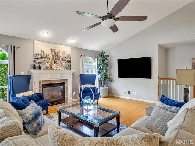 22 Foxmoor Dr, Maryville, IL 62062 - living area with lofted ceiling, a ceiling fan, healthy amount of natural light, wood finished floors, and a fireplace