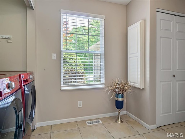 22 Foxmoor Dr, Maryville, IL 62062 - washroom featuring washing machine and dryer, healthy amount of natural light, and light tile patterned floors
