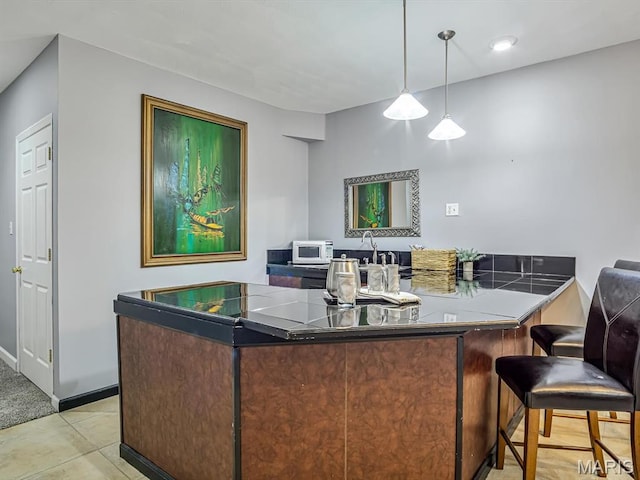 22 Foxmoor Dr, Maryville, IL 62062 - bar area featuring white microwave and hanging light fixtures