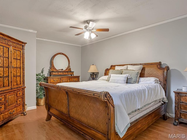 22 Foxmoor Dr, Maryville, IL 62062 - bedroom featuring light wood finished floors, crown molding, and ceiling fan