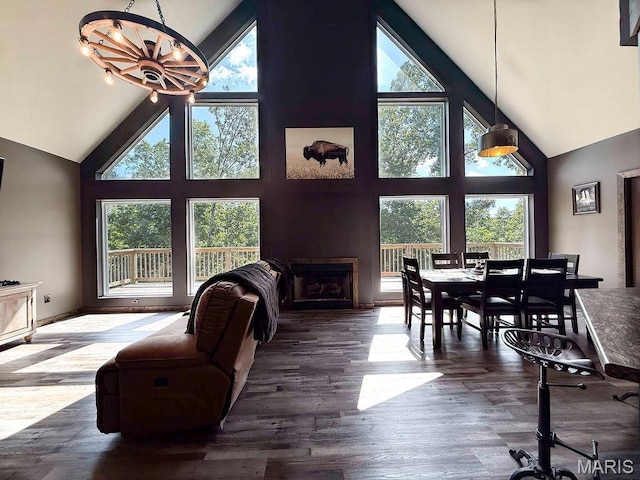 10185 Springer Dr, Bonne Terre, MO 63628 - living room with high vaulted ceiling, a chandelier, a fireplace, and dark wood-style floors