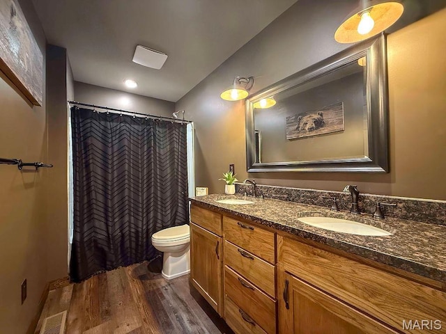 10185 Springer Dr, Bonne Terre, MO 63628 - bathroom featuring wood finished floors, double vanity, and a shower with curtain