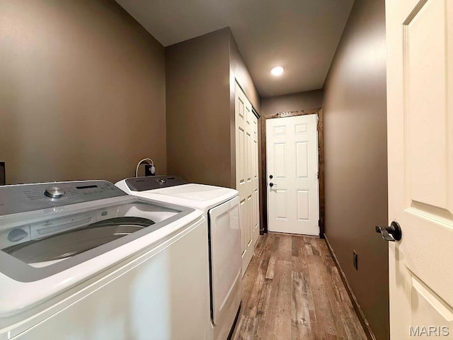 10185 Springer Dr, Bonne Terre, MO 63628 - washroom with washing machine and dryer and wood finished floors