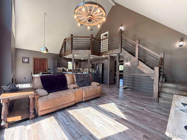 10185 Springer Dr, Bonne Terre, MO 63628 - living room with high vaulted ceiling, wood finished floors, and stairs