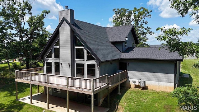 10185 Springer Dr, Bonne Terre, MO 63628 - back of house featuring a deck, a patio area, a yard, and roof with shingles