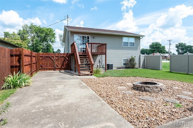 221 James St, Bethalto, IL 62010 - view of front of property featuring an outdoor fire pit, stairs, a wooden deck, and a gate