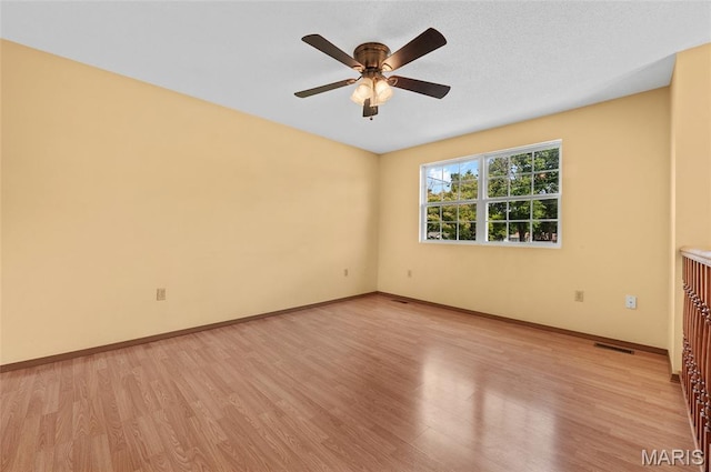 221 James St, Bethalto, IL 62010 - spare room featuring light wood-type flooring and a ceiling fan