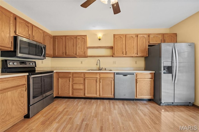 221 James St, Bethalto, IL 62010 - kitchen with stainless steel appliances, open shelves, light wood-style flooring, and ceiling fan