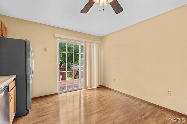 221 James St, Bethalto, IL 62010 - unfurnished dining area featuring light wood-style floors and a ceiling fan