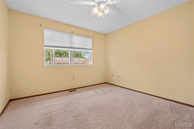 221 James St, Bethalto, IL 62010 - carpeted spare room featuring a ceiling fan and baseboards