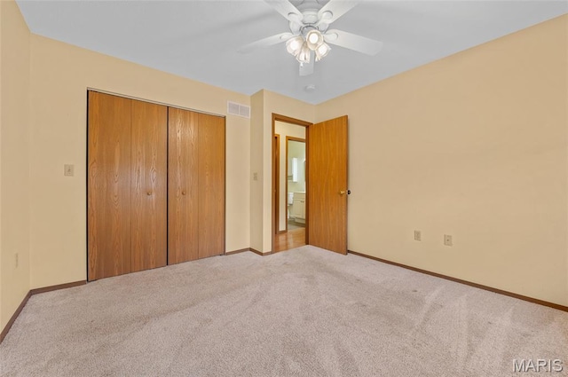 221 James St, Bethalto, IL 62010 - unfurnished bedroom with carpet flooring, a closet, and ceiling fan
