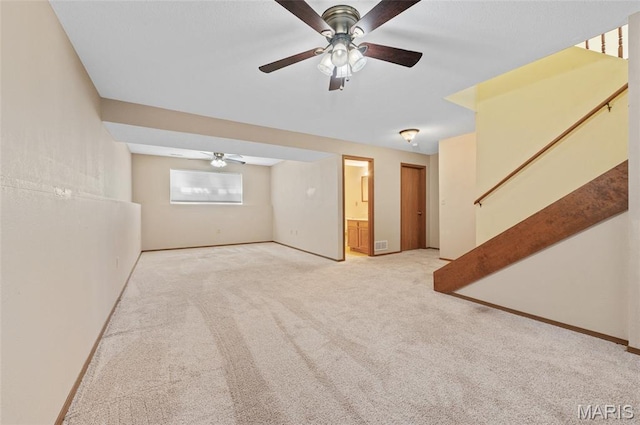 221 James St, Bethalto, IL 62010 - unfurnished living room with ceiling fan, light carpet, and stairway