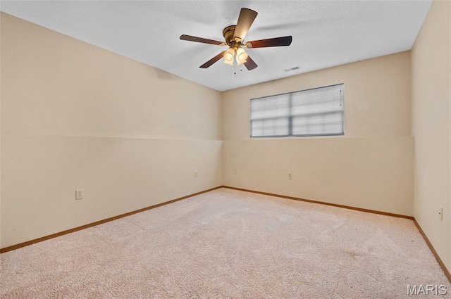 221 James St, Bethalto, IL 62010 - carpeted spare room featuring baseboards and a ceiling fan