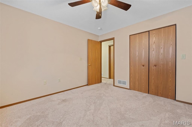 221 James St, Bethalto, IL 62010 - unfurnished bedroom with carpet flooring, a closet, and a ceiling fan